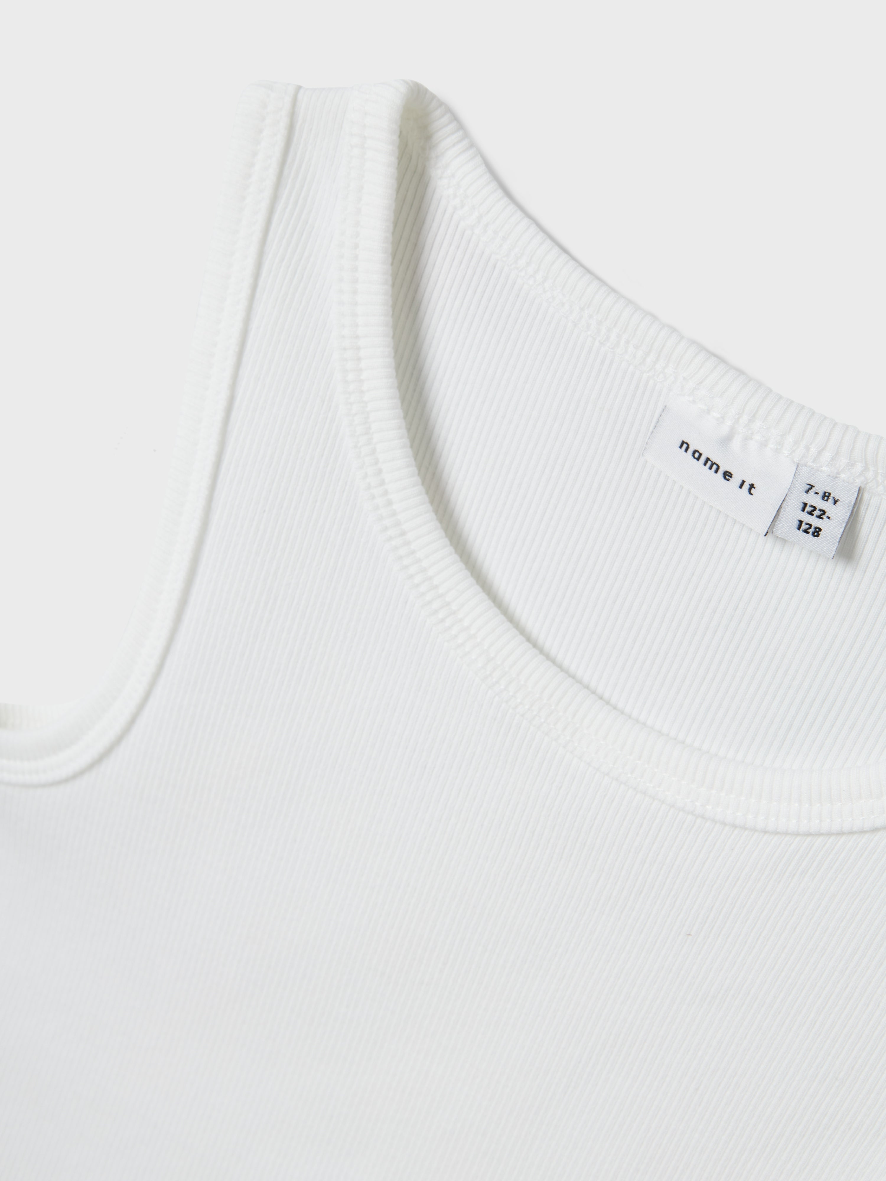 Camiseta Abertura Lazo Blanca Kid
