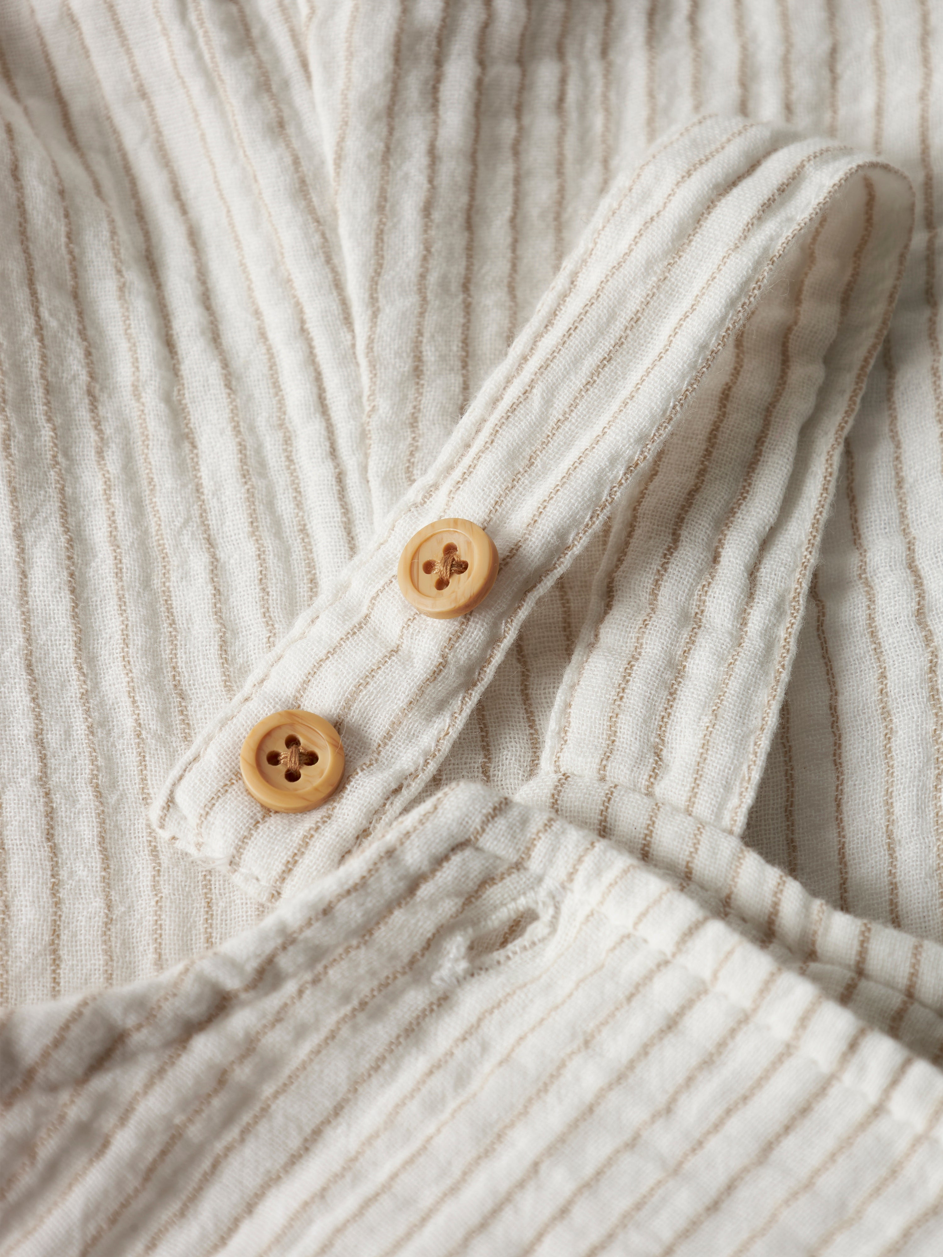 Peto Rayas Beige Bebé